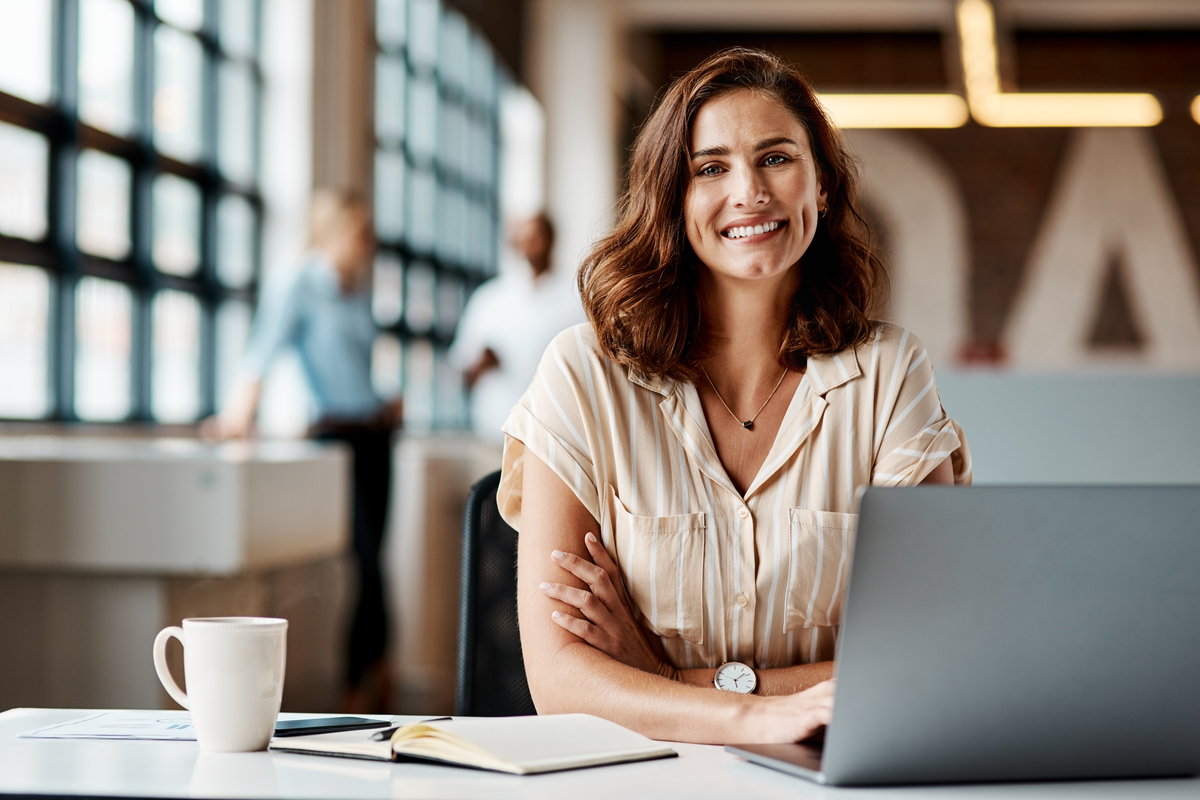 Shot of a young businesswoman using a laptop in a modern office