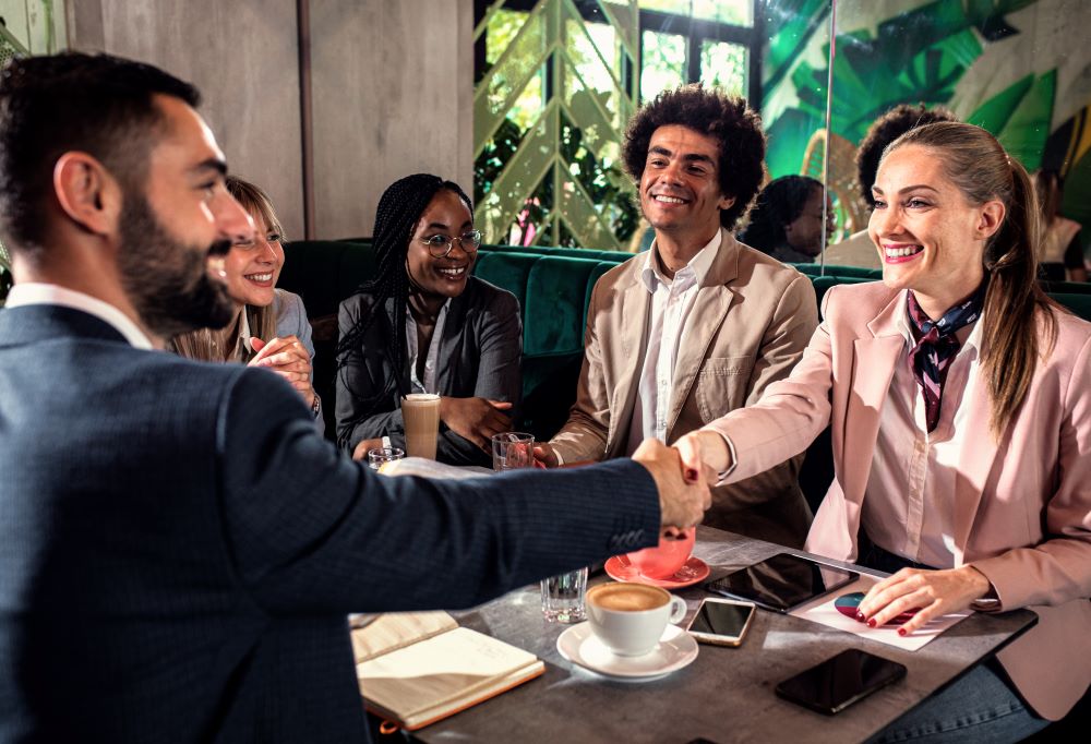 group-of-business-people-having-meeting-in-cafe-2025-01-30-05-36-27-utc