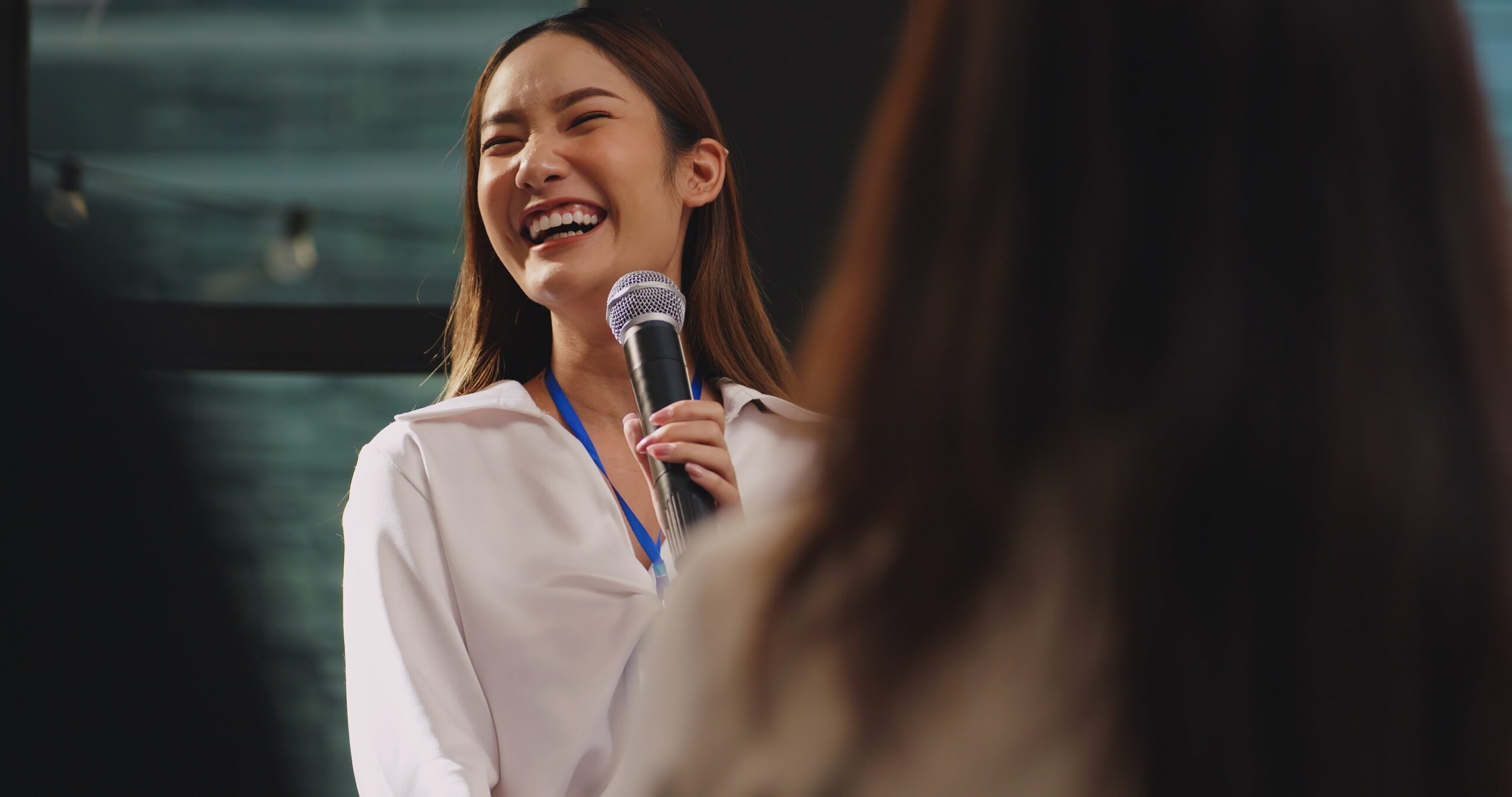 Confident,Young,Businesswoman,Or,Speaker,Sharing,Ideas,With,Colleagues,Or