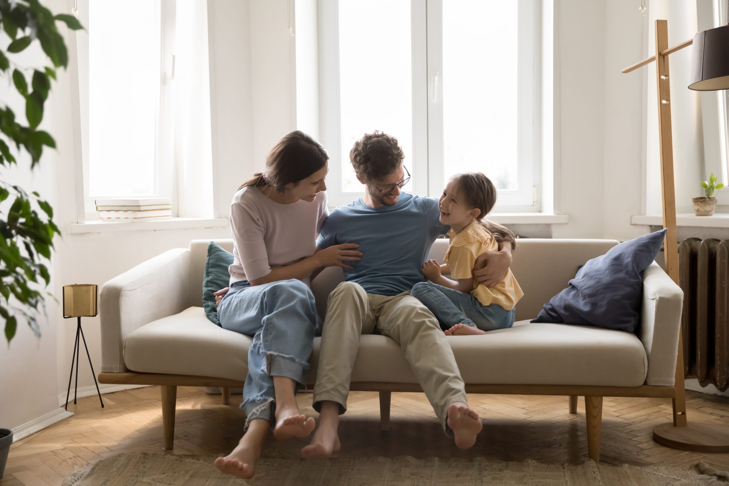 Loving,Spouses,Relax,At,Home,With,Little,Cute,Girl,Child